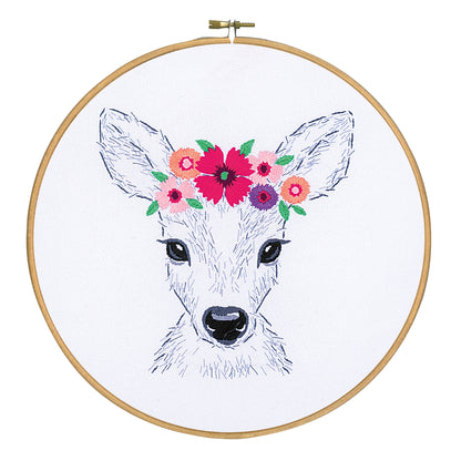 Embroidered cushion showing a deer surrounded by flowers