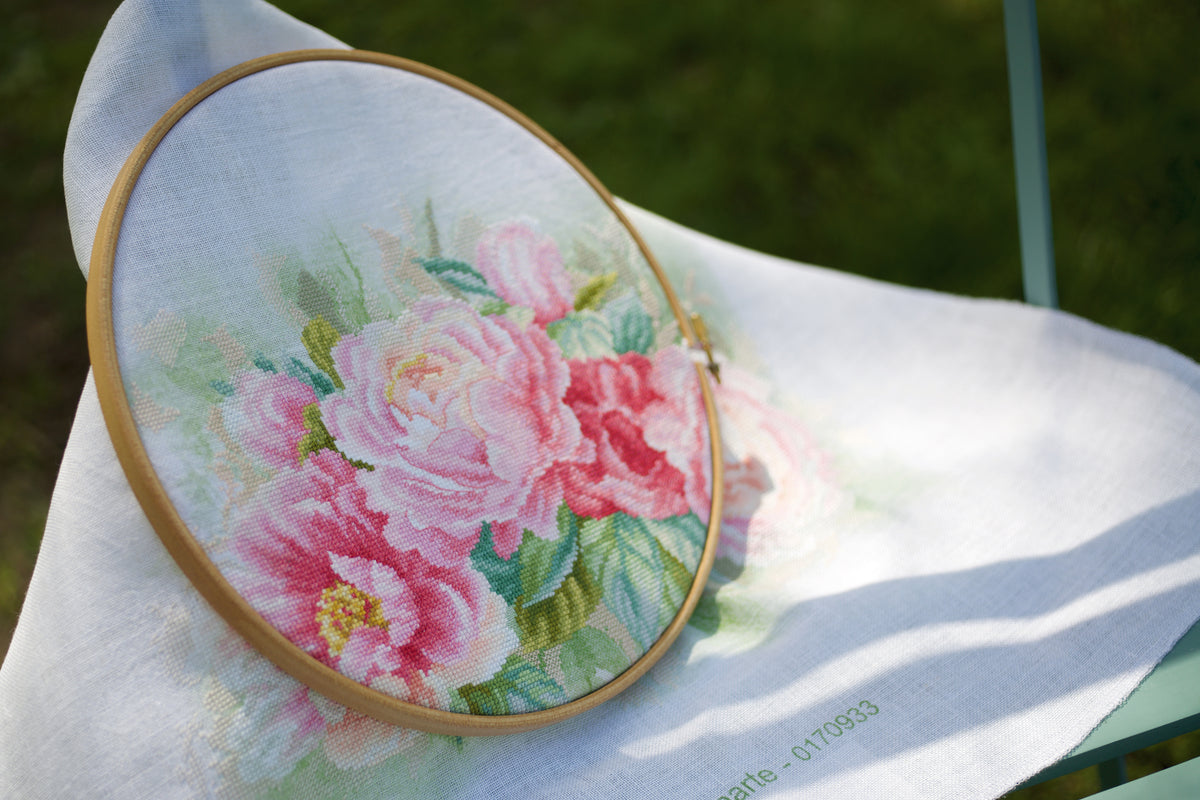 Cross stitch picture of a bouquet of peonies