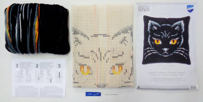 Cross stitch cushion with a black cat design
