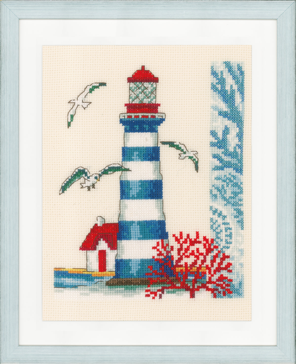 Cross stitch of a lighthouse on ecru fabric