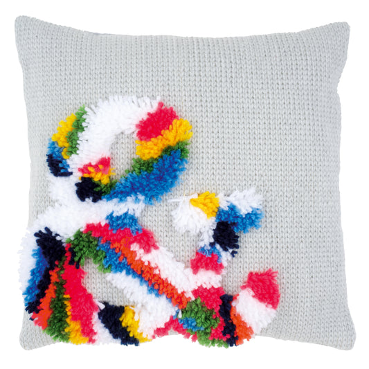 Latch hook cushion with a bright ampersand design