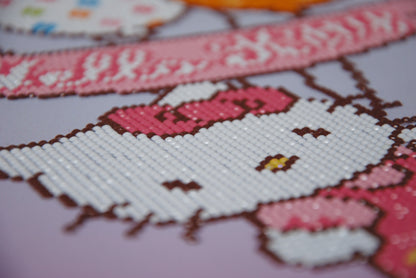 Diamond painting of Hello Kitty holding balloons