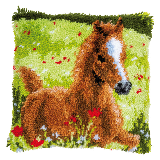 Latch hook cushion with a young foal