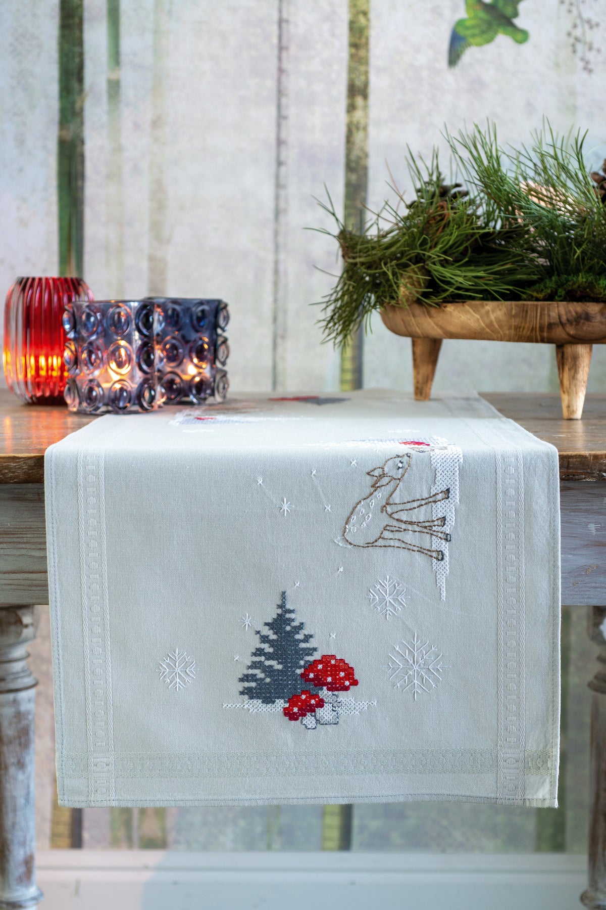 Embroidered table runner with a winter Christmas landscape