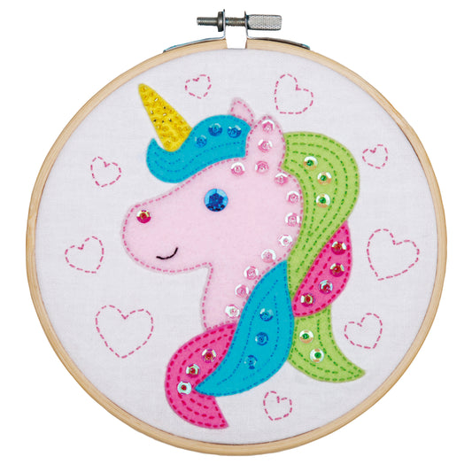 Unicorn embroidery in a bamboo hoop