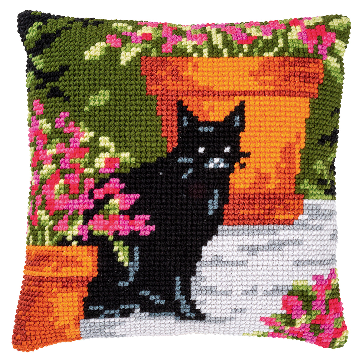 Cross stitch cushion with a cat among flowers