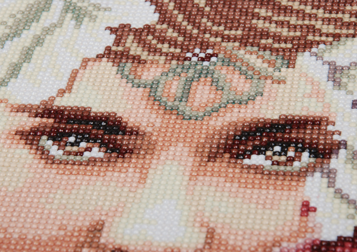 Diamond painting of a face with striking eyes