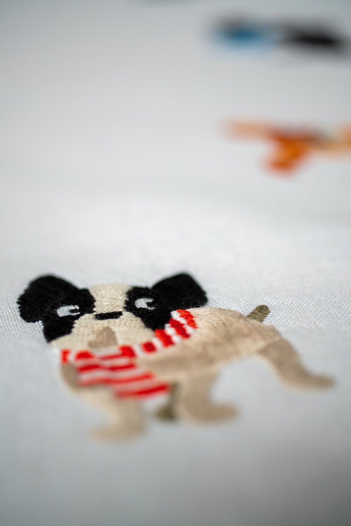 Embroidered tablecloth with dog designs