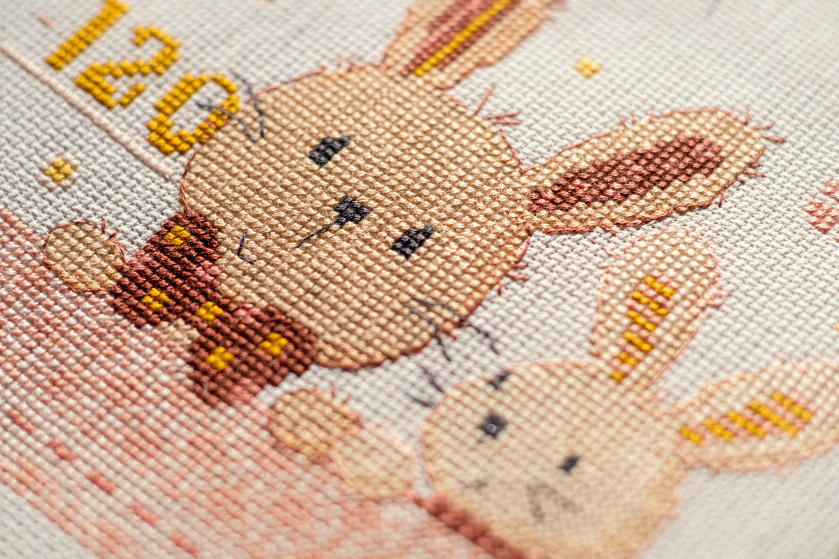 Long cross stitch design of bunnies