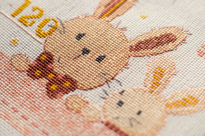 Long cross stitch design of bunnies