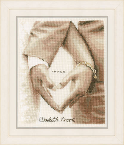 Cross stitch wedding design with a heart