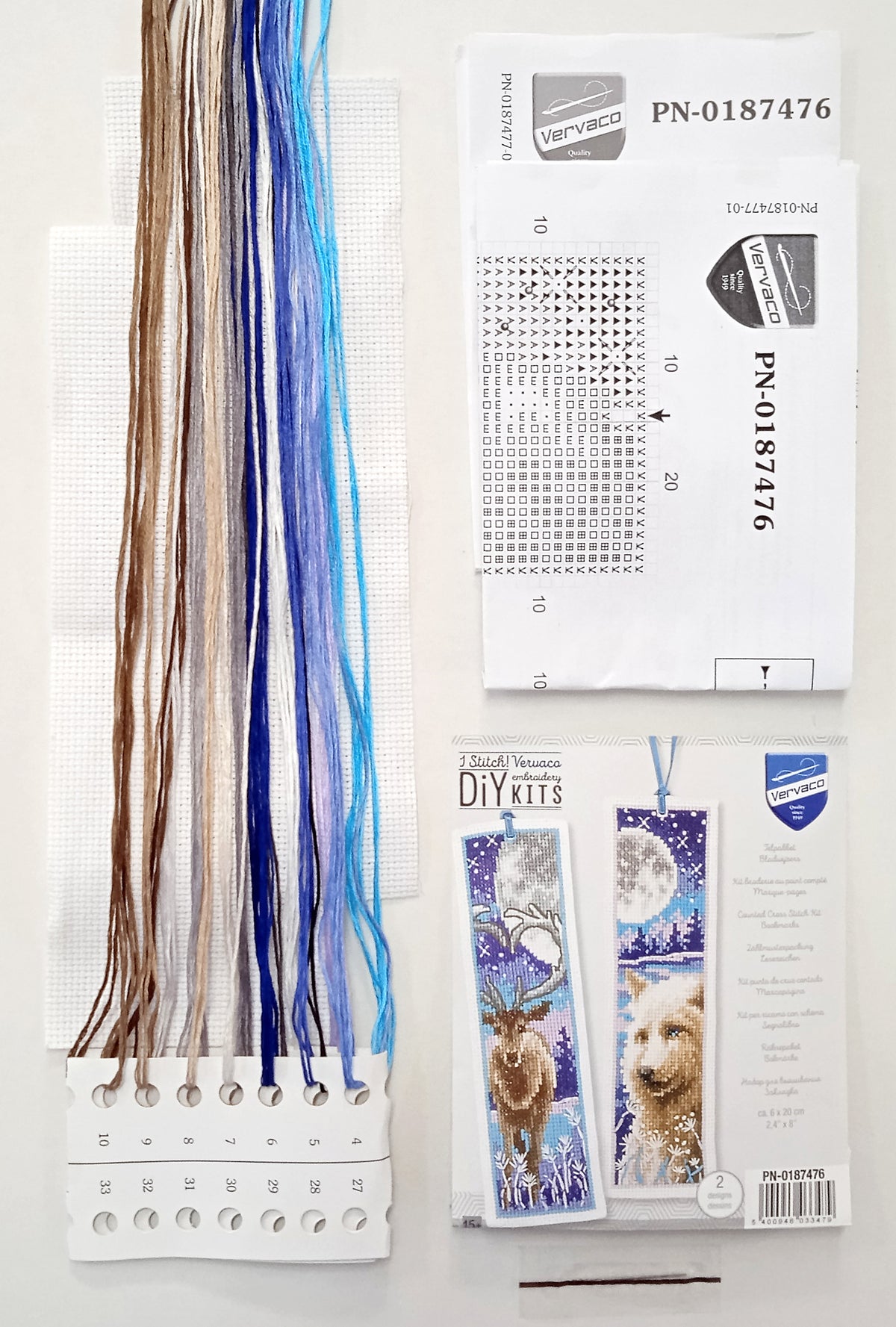 Two cross stitched bookmarks with a wolf and deer with moon design