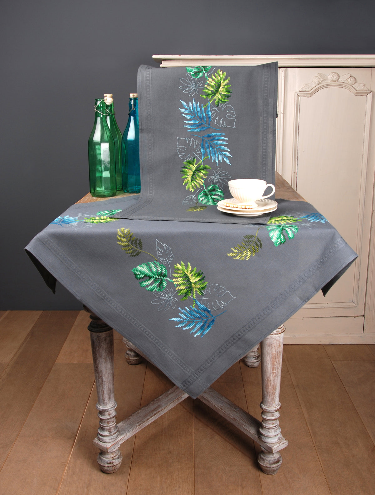Embroidered tablecloth with a botanical leaves design