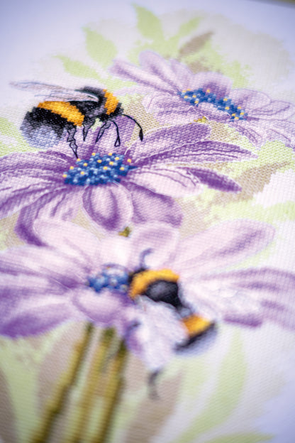 Cross stitch picture of dancing bees