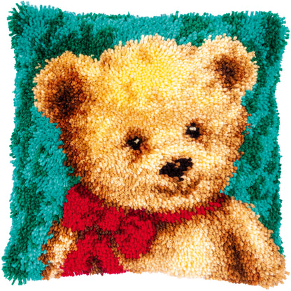 Latch hook cushion showing a little bear design