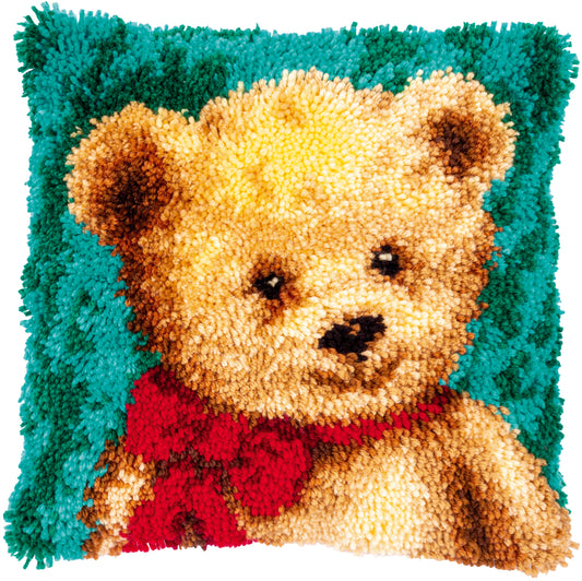 Latch hook cushion showing a little bear design