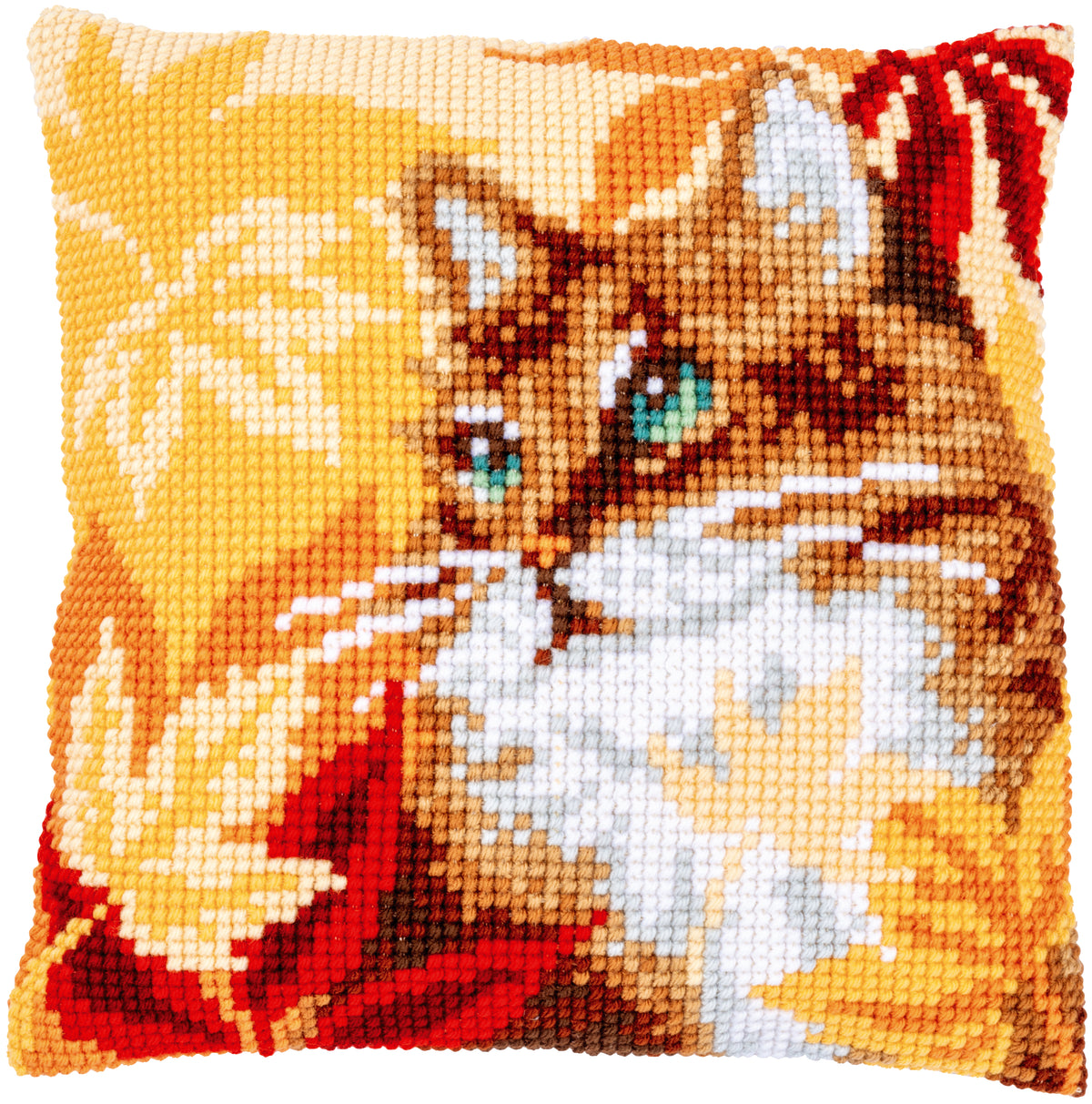 Cross stitch cushion of a cat surrounded by autumn leaves