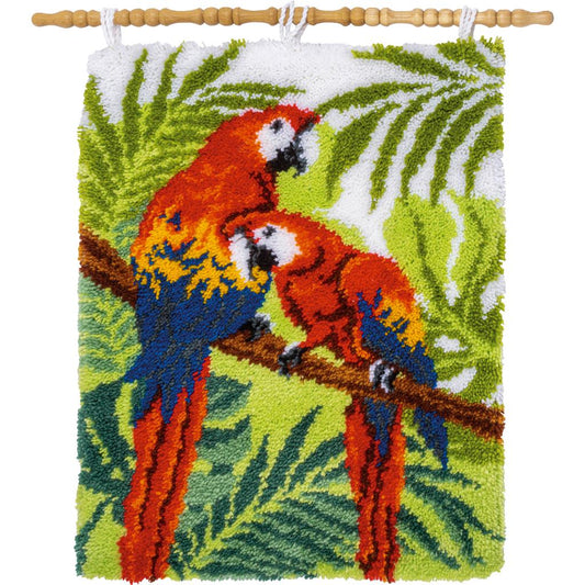 Latch hook rug with colourful parrots in jungle leaves