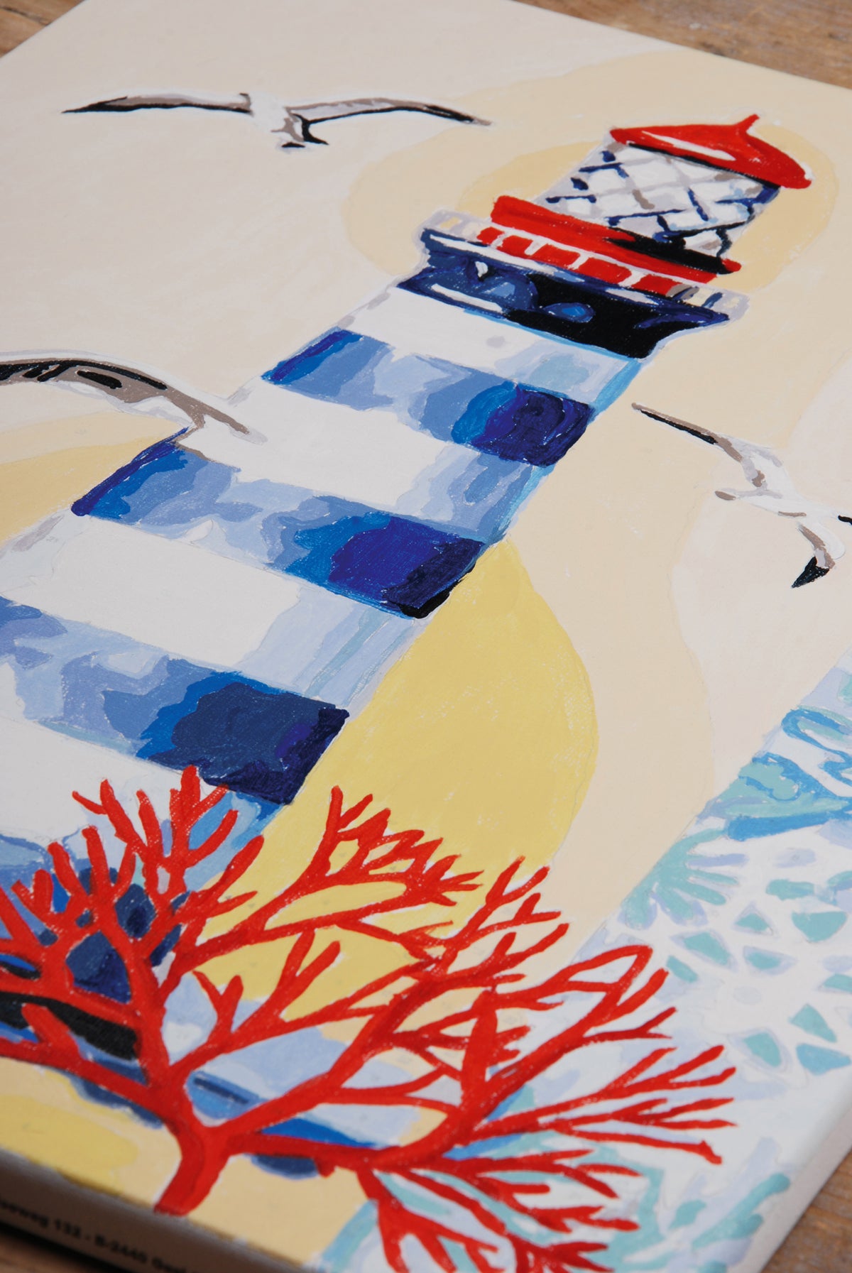 Painting of a lighthouse by the sea