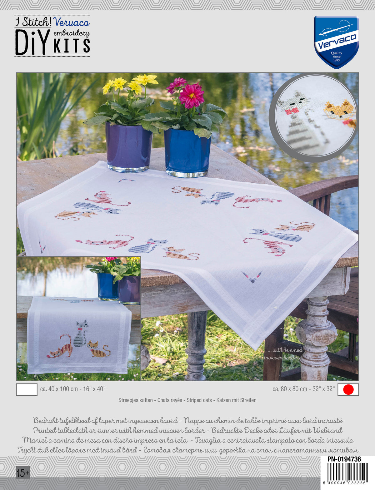 White tablecloth embroidered with striped cats