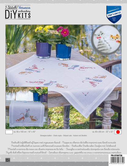White tablecloth embroidered with striped cats