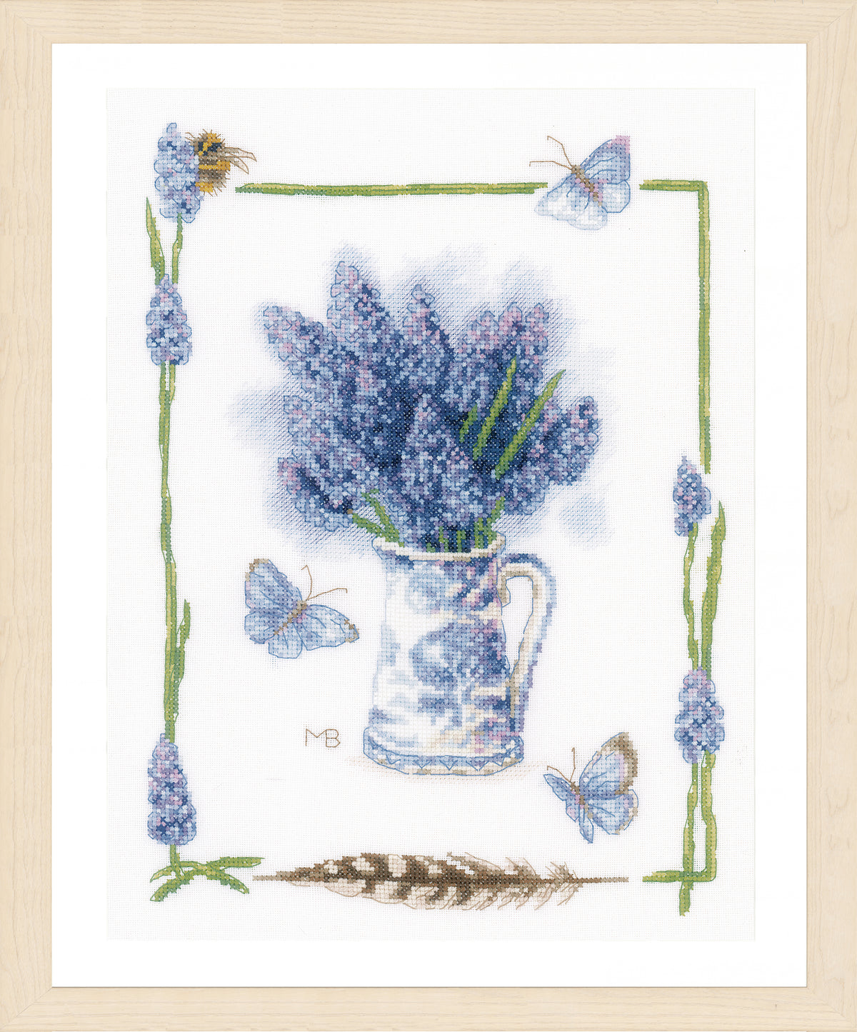 Finished Lanarte cross stitch of blue grapes