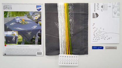 Grey table runner embroidered with white daisies