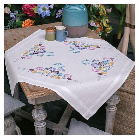 Square white tablecloth embroidered with blue and purple allium flowers