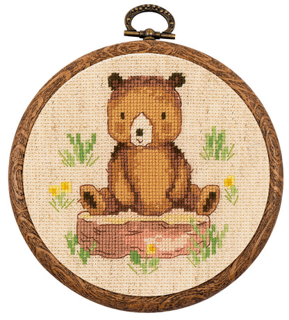 Three small cross stitch forest animal designs in round hoops