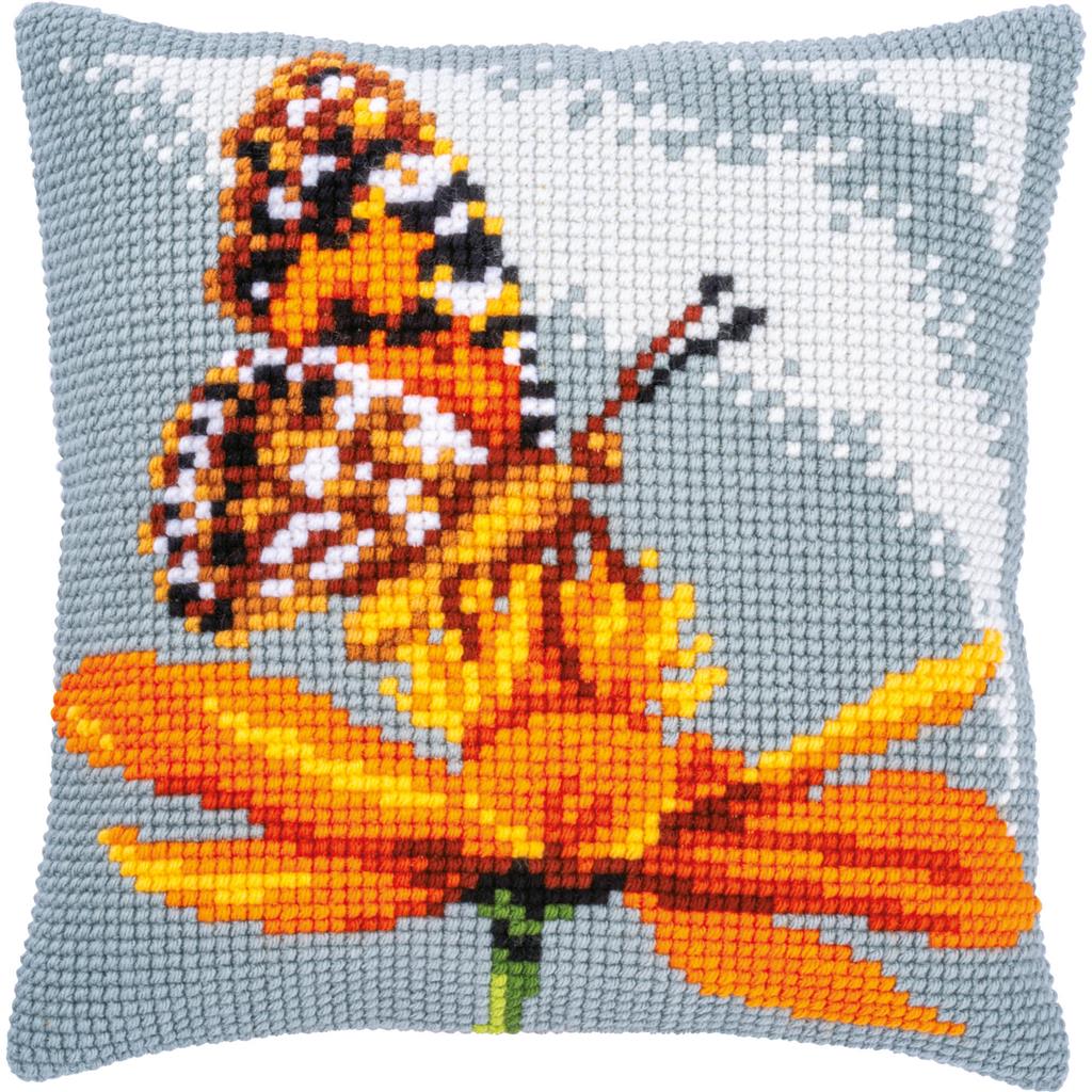 Square cushion stitched with a colourful butterfly