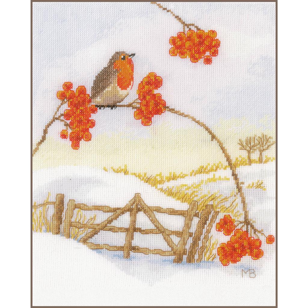 Cross stitch picture of a snowy winter scene