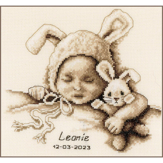 Cross stitch birth record with a baby and a toy rabbit