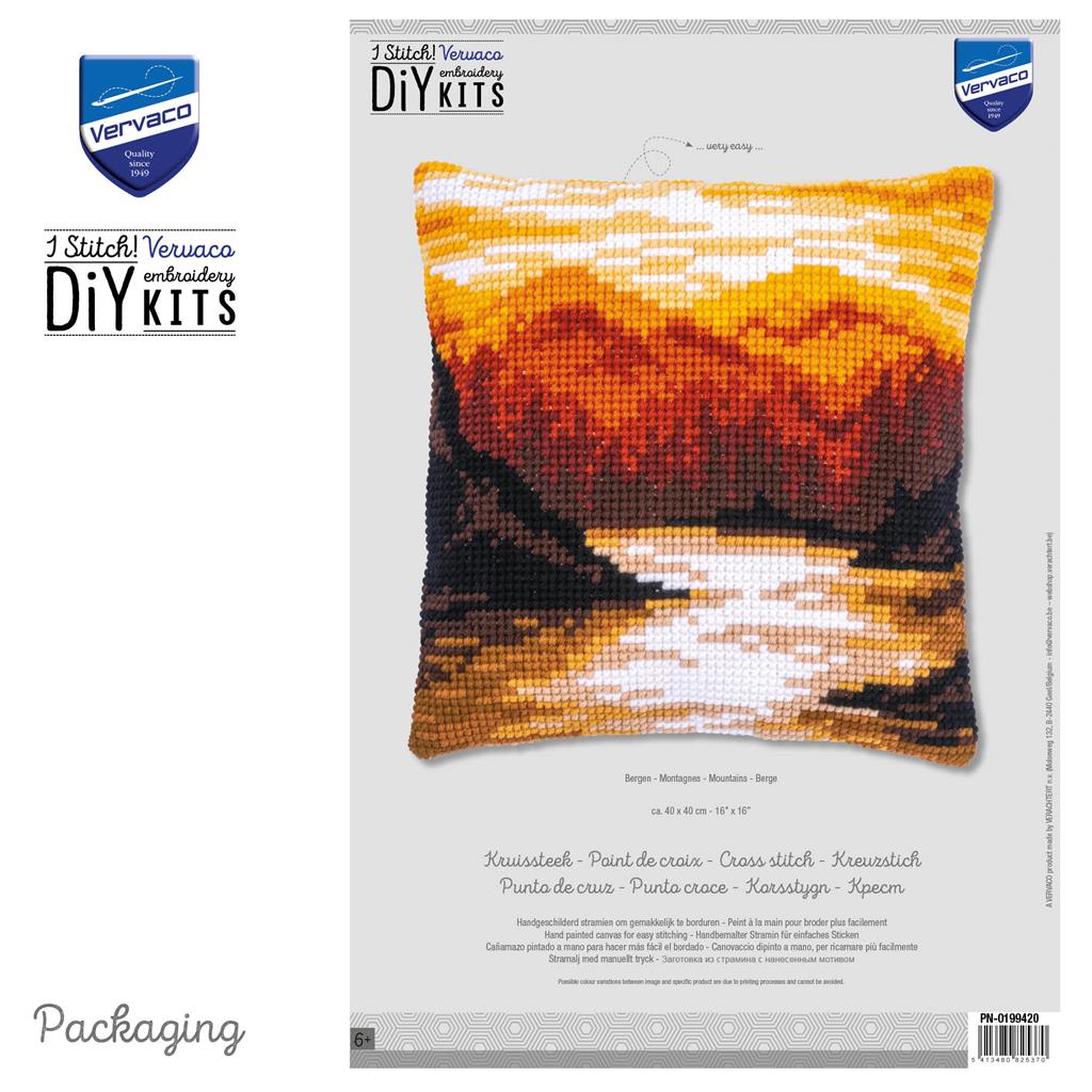 Cross stitch cushion with a mountain landscape design
