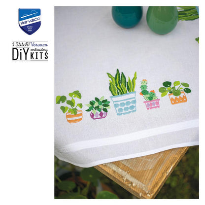 Embroidered tablecloth with house plants design