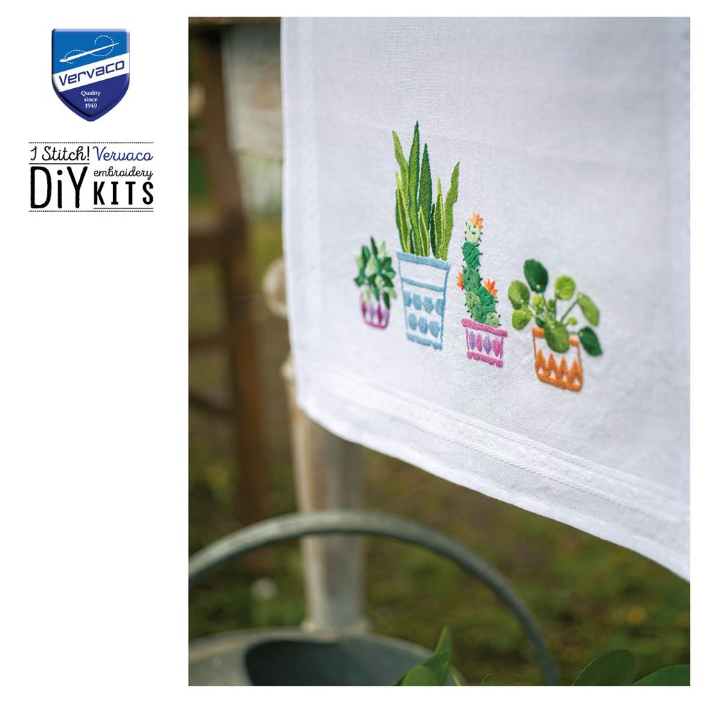 Embroidered table runner with house plants design
