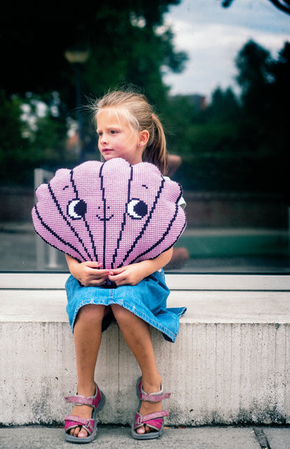 Shell shaped cross stitch cushion by Eva Mouton