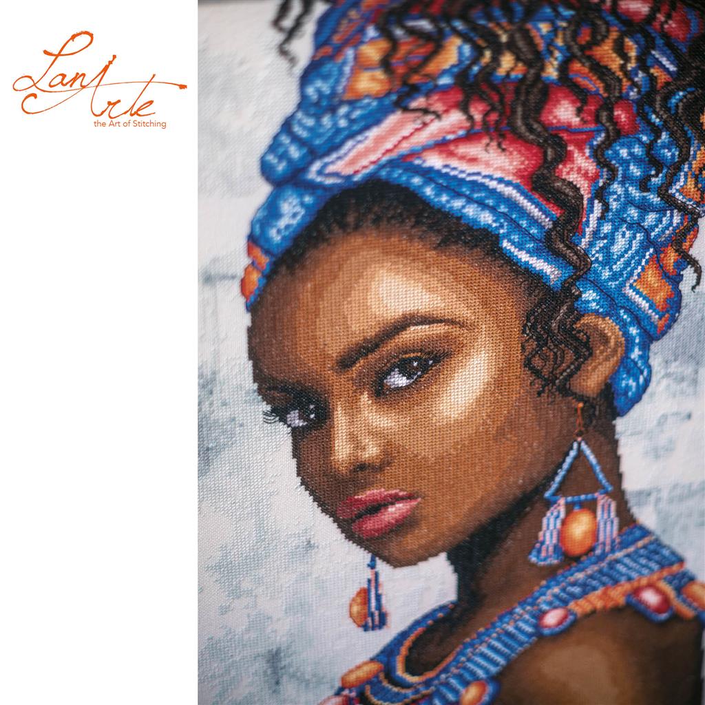 Cross stitch portrait of a woman wearing a headscarf