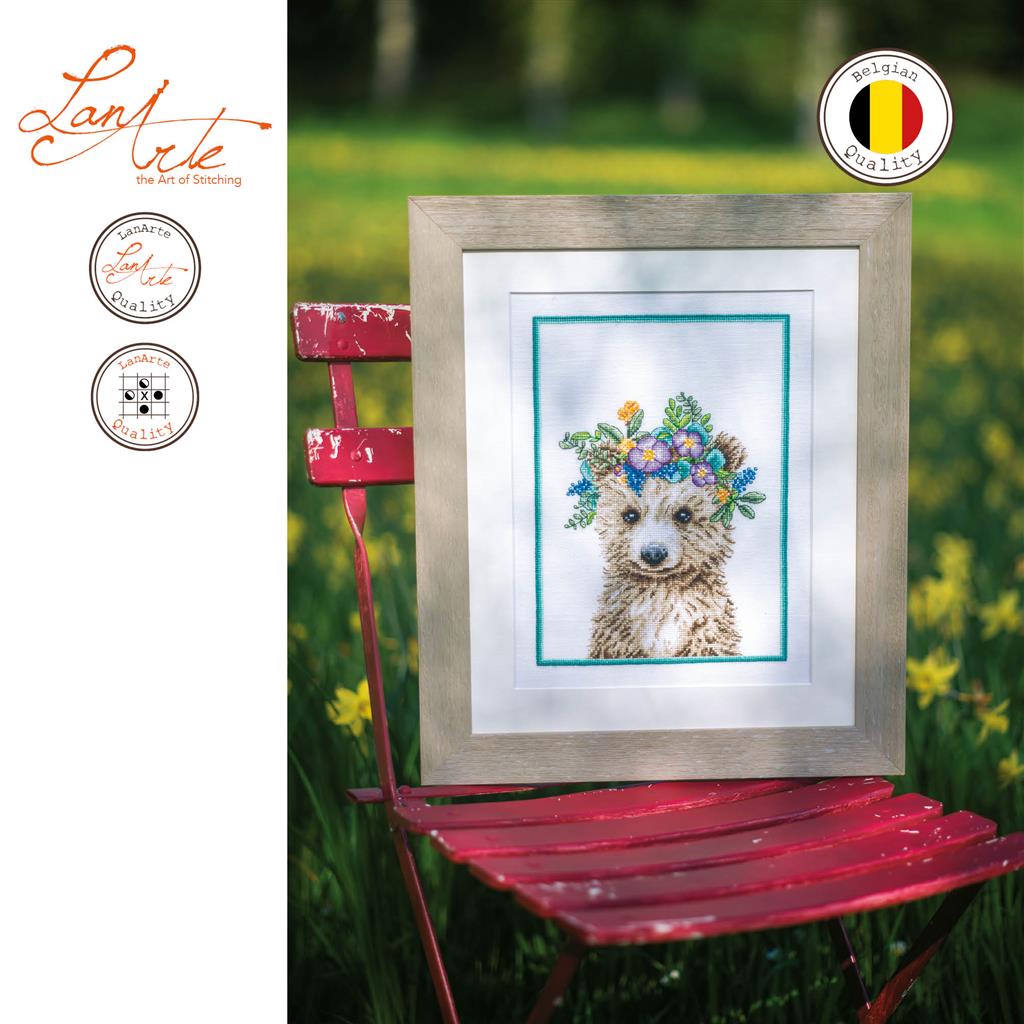 Cross stitch picture of a bear wearing a flower crown