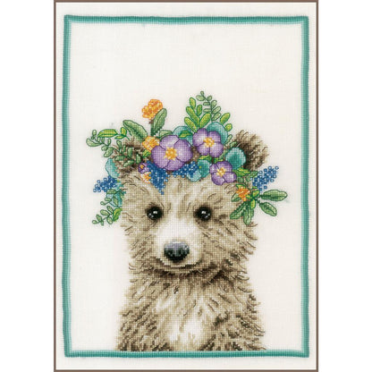 Cross stitch picture of a bear wearing a flower crown