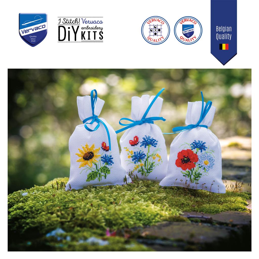 Three small cross stitch bags with field flowers designs