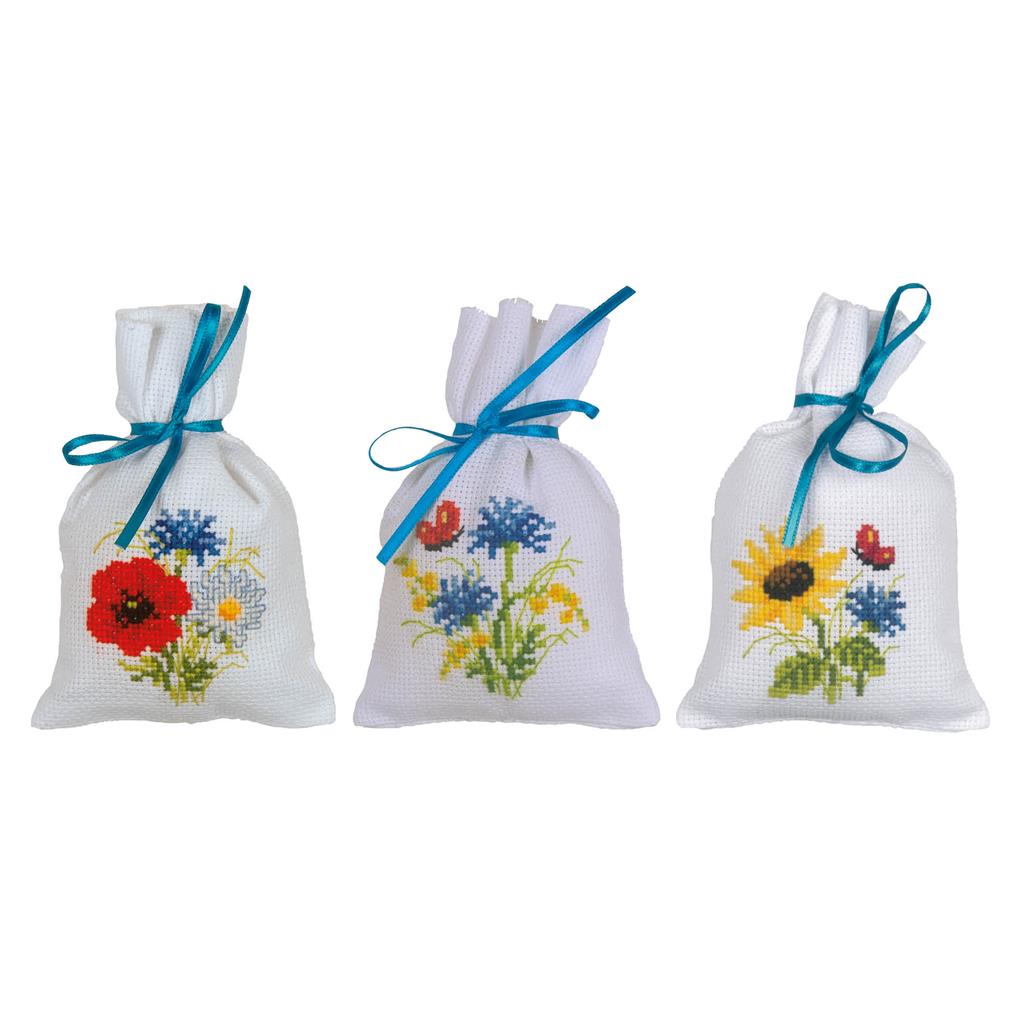 Three small cross stitch bags with field flowers designs