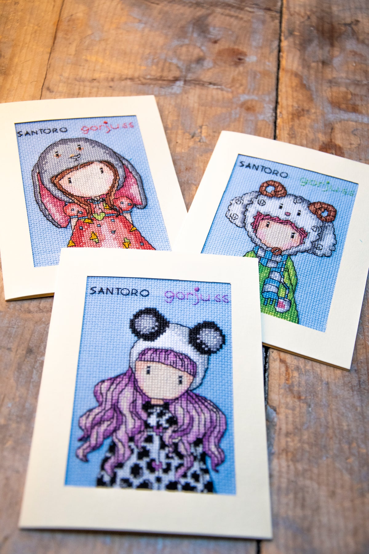 Three Gorjuss cross stitch greetings cards from the Vervaco kit