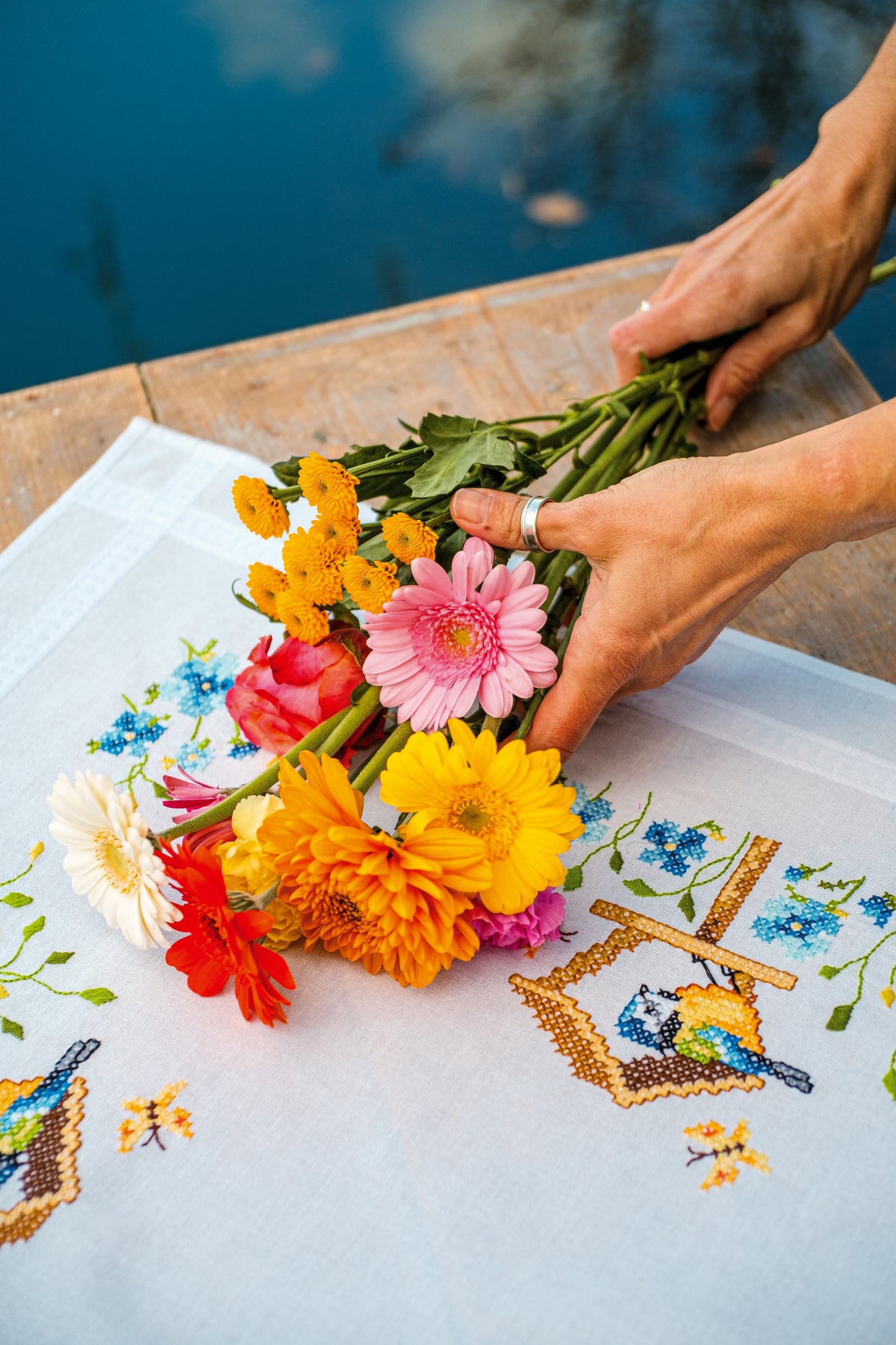 Embroidered tablecloth with birdhouses design