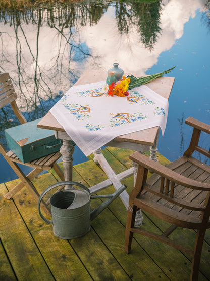 Embroidered tablecloth with birdhouses design