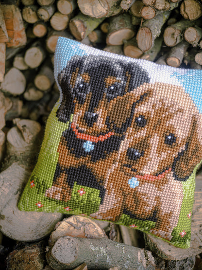 Cross stitched cushion with dachshund dogs