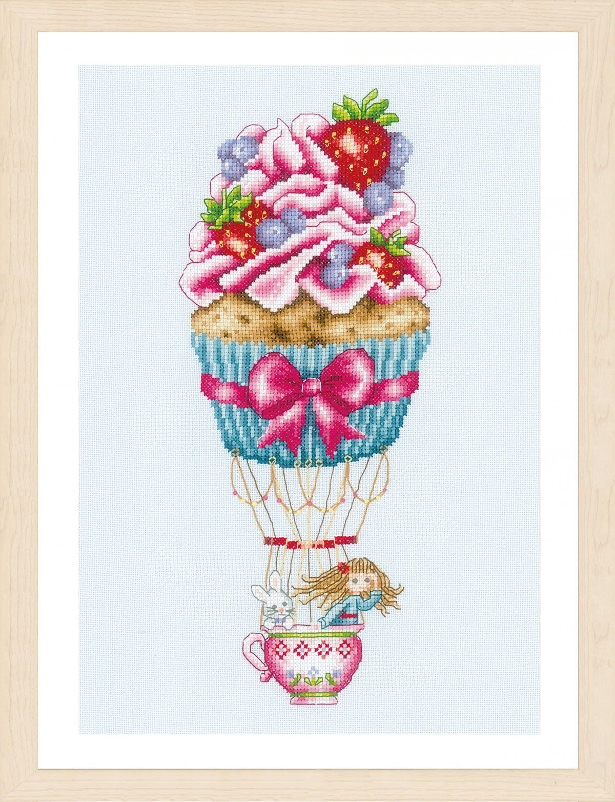 Cross stitched cupcake shaped like a hot air balloon