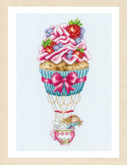 Cross stitched cupcake shaped like a hot air balloon