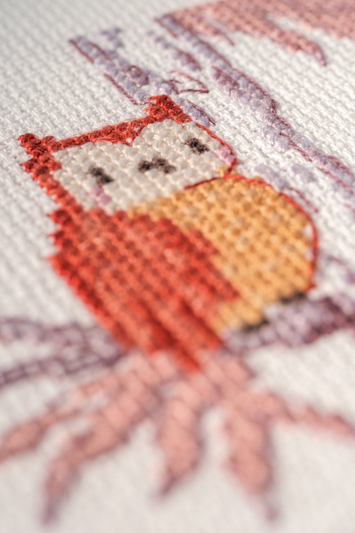 Cross stitch of woodland animals in a forest