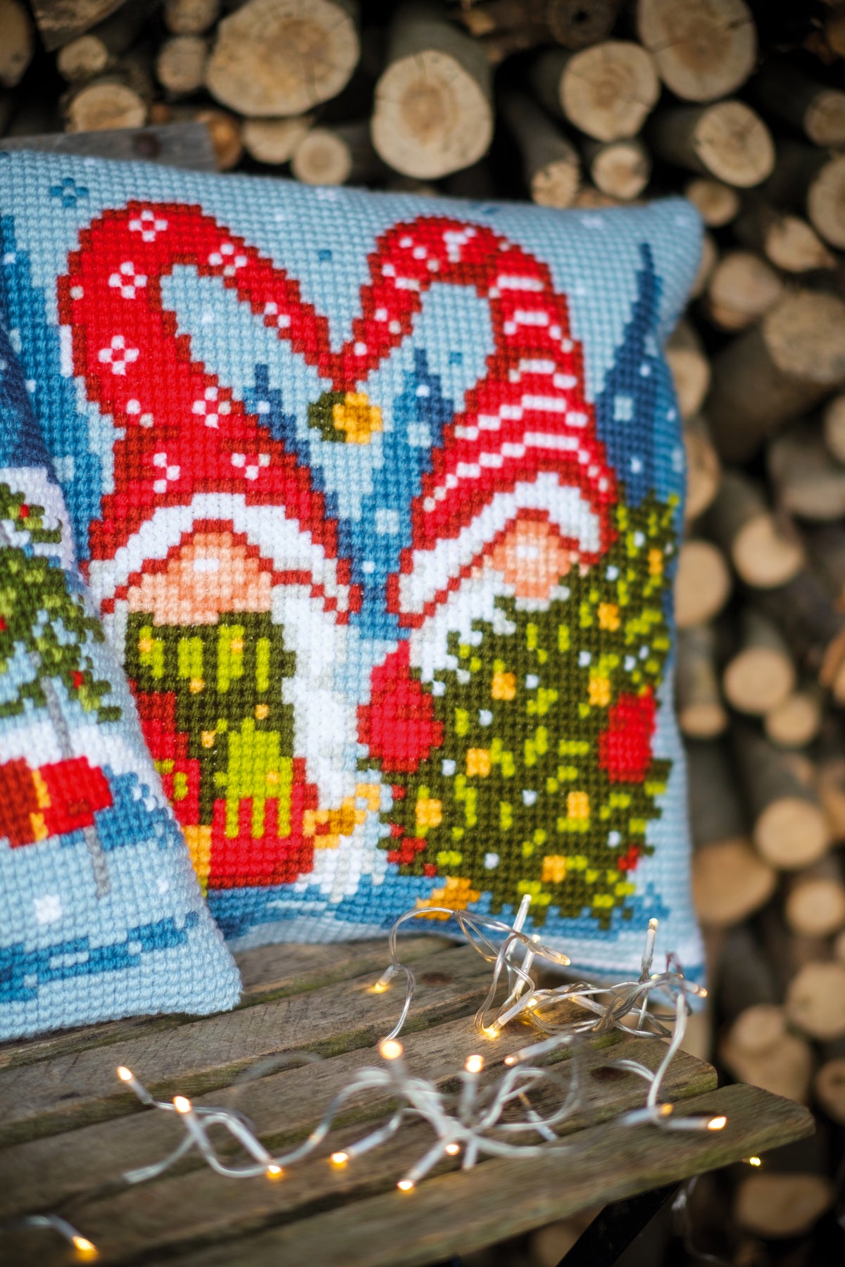Cross stitch cushion with Christmas gnomes