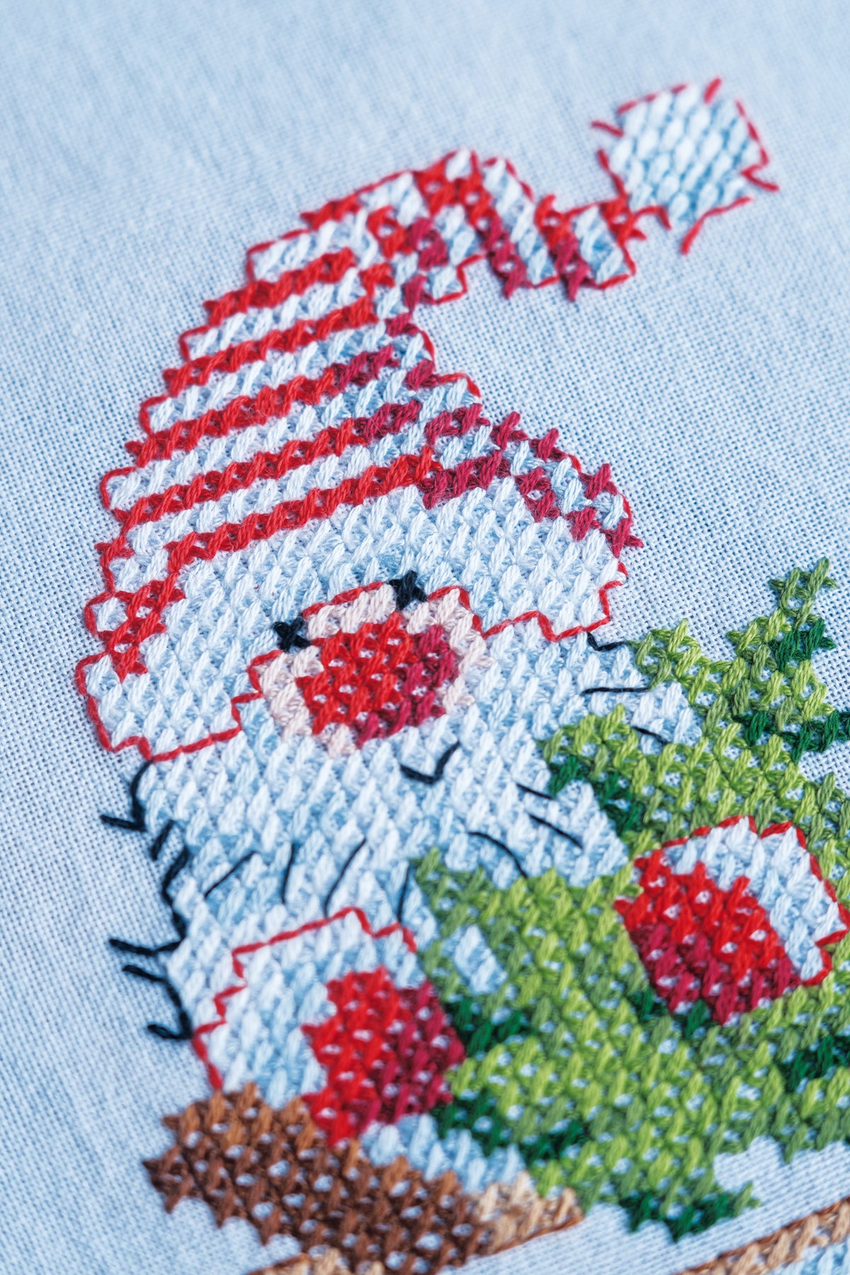 Embroidered tablecloth with gnome and reindeer motifs